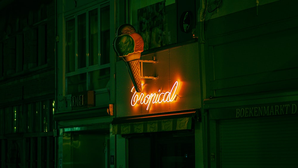 a neon sign on the side of a building