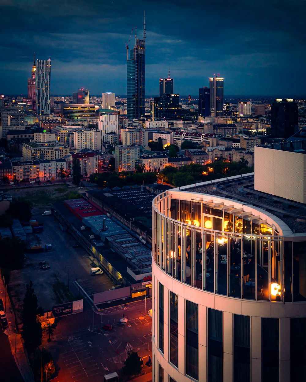 a view of a city at night from the top of a building