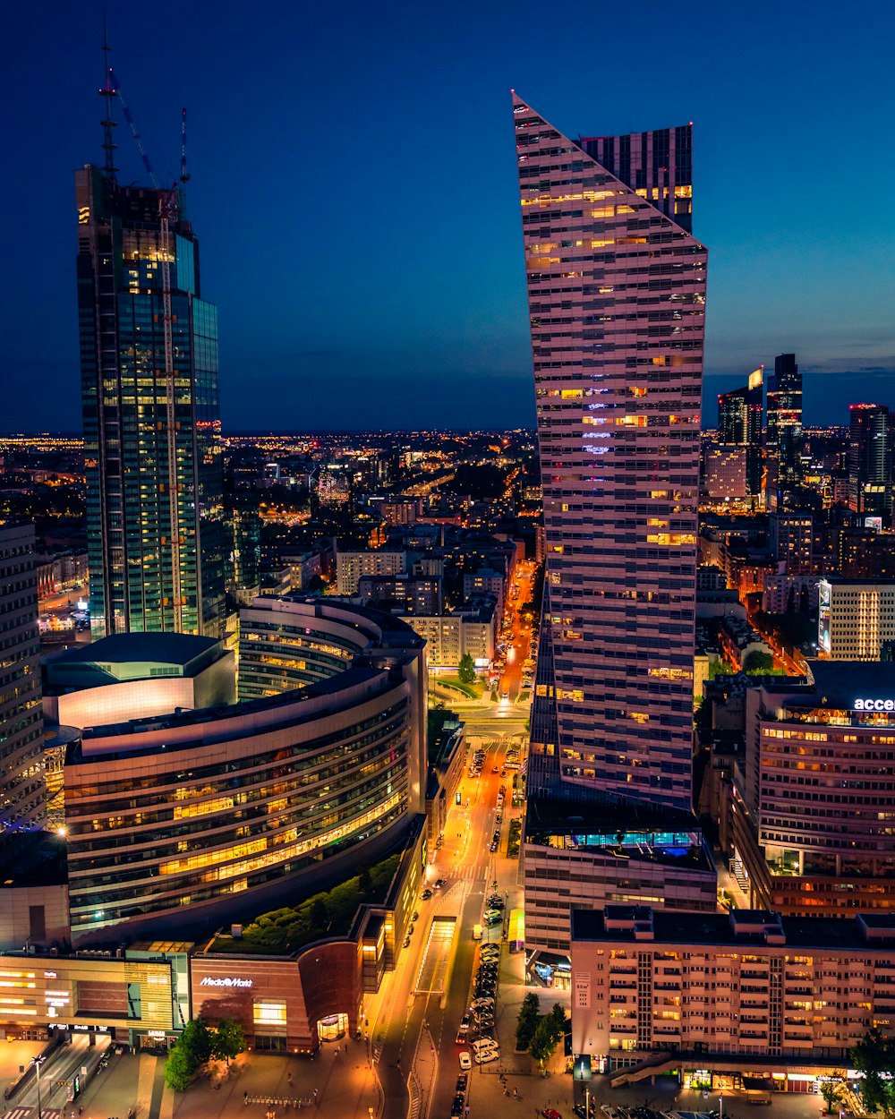 a city at night with a lot of tall buildings