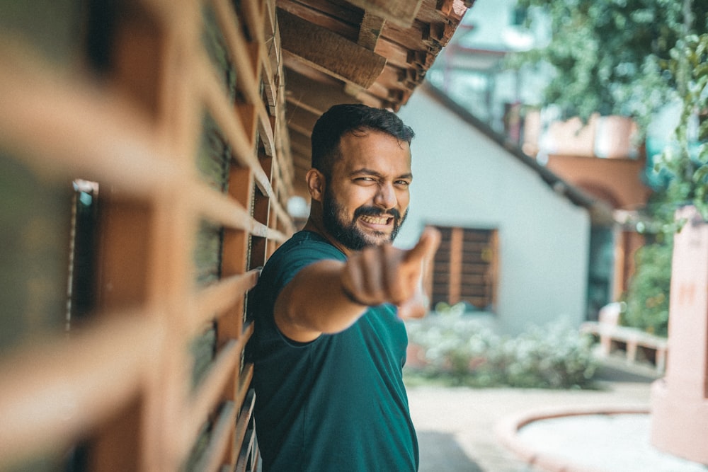 a man pointing his finger at the camera