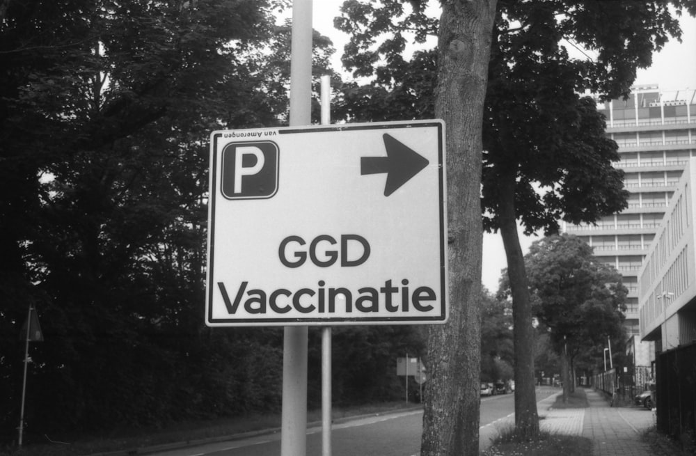 a black and white photo of a street sign