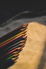 Close-up of minimalist pencil cases and erasers with soft natural light.