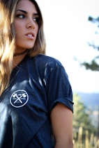 a woman with long hair wearing a blue shirt