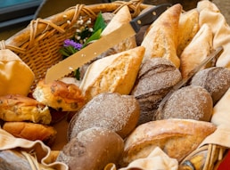 a basket filled with lots of different types of bread