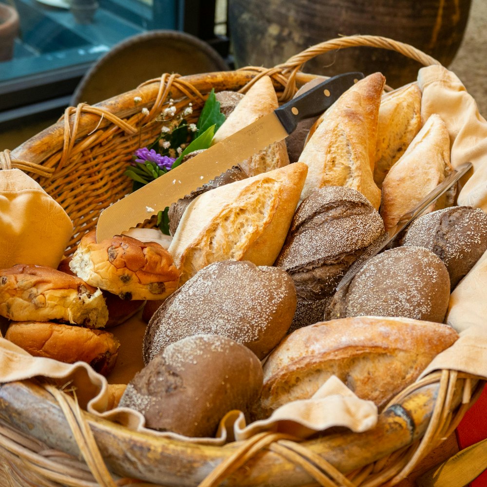 a basket filled with lots of different types of bread