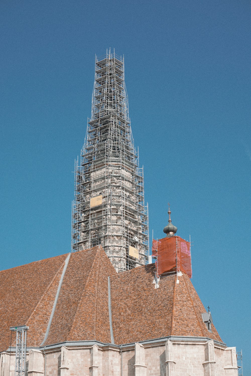 a church with scaffolding on top of it