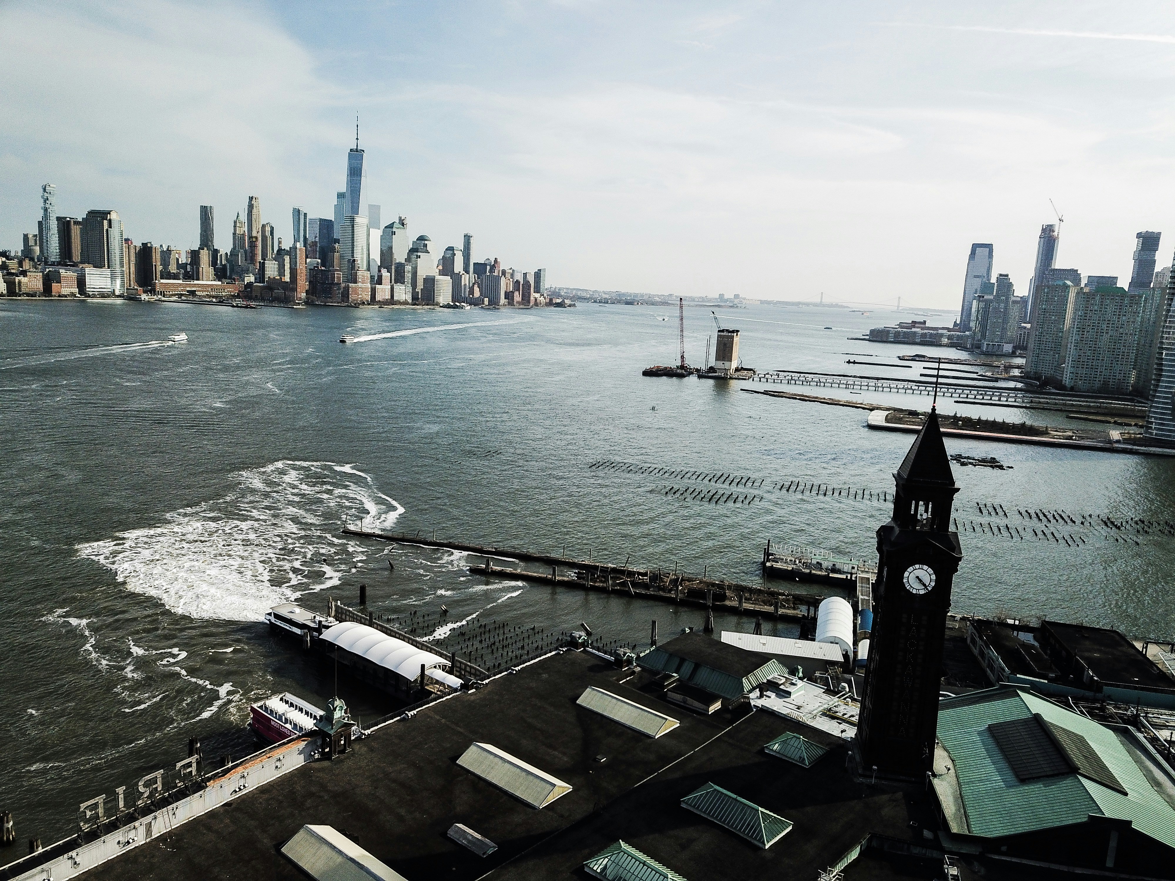 a large body of water with a city in the background