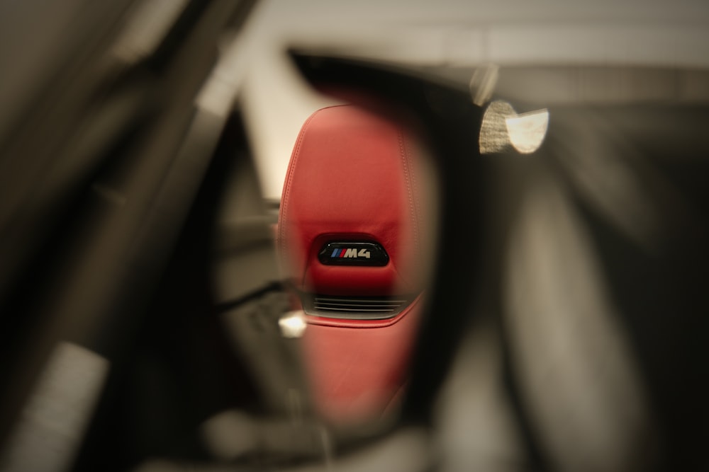 a view of the inside of a car through a mirror