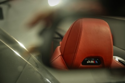 A stylish BMW interior shot showcasing plush leather seats and ambient lighting.