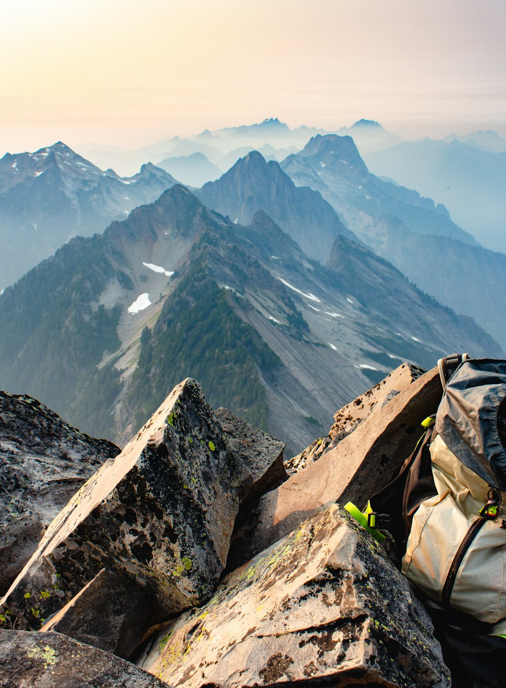 a backpack sitting on top of a mountain