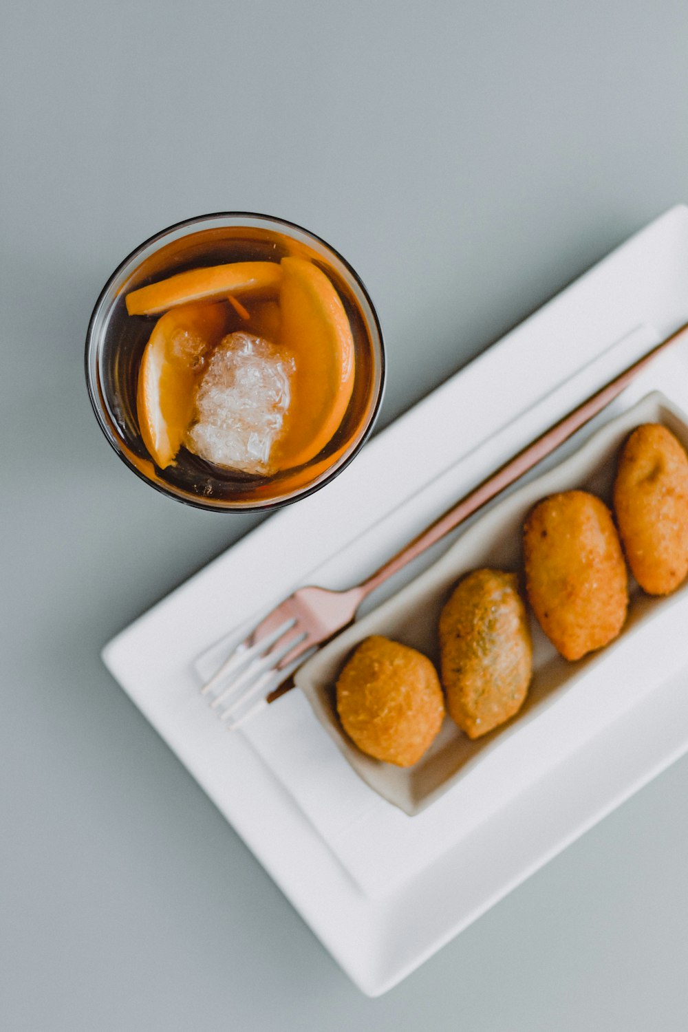 a plate of food and a drink on a table