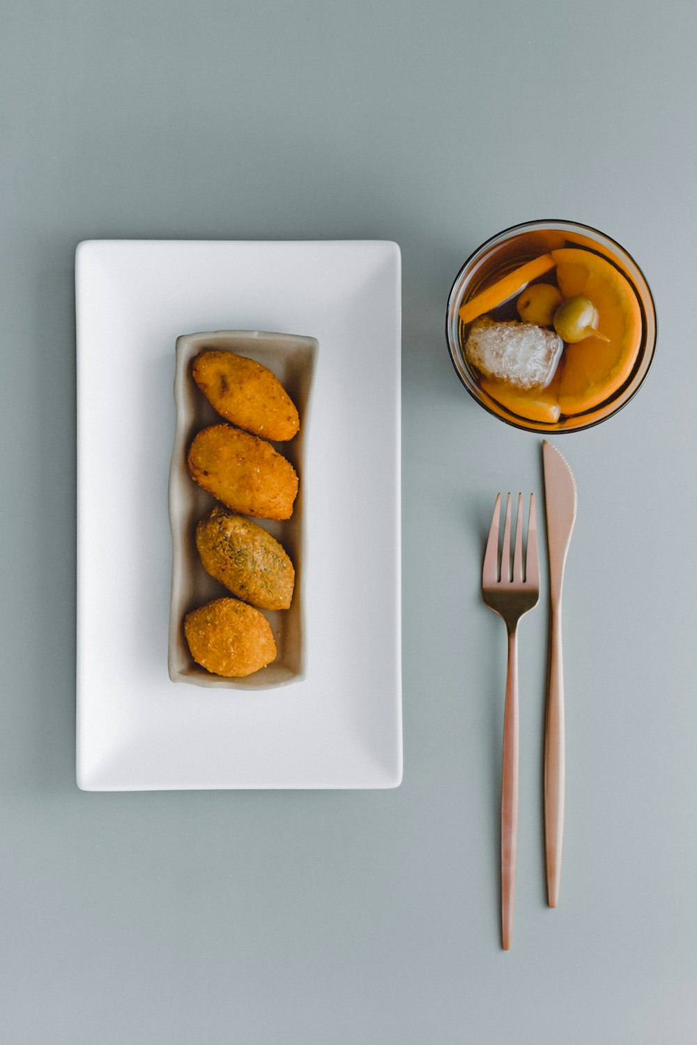 a white plate topped with food next to a fork