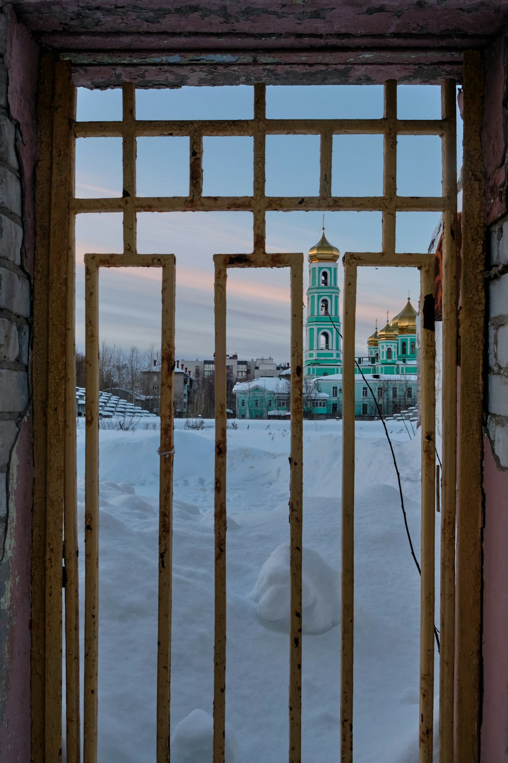 a view of a building through a gate