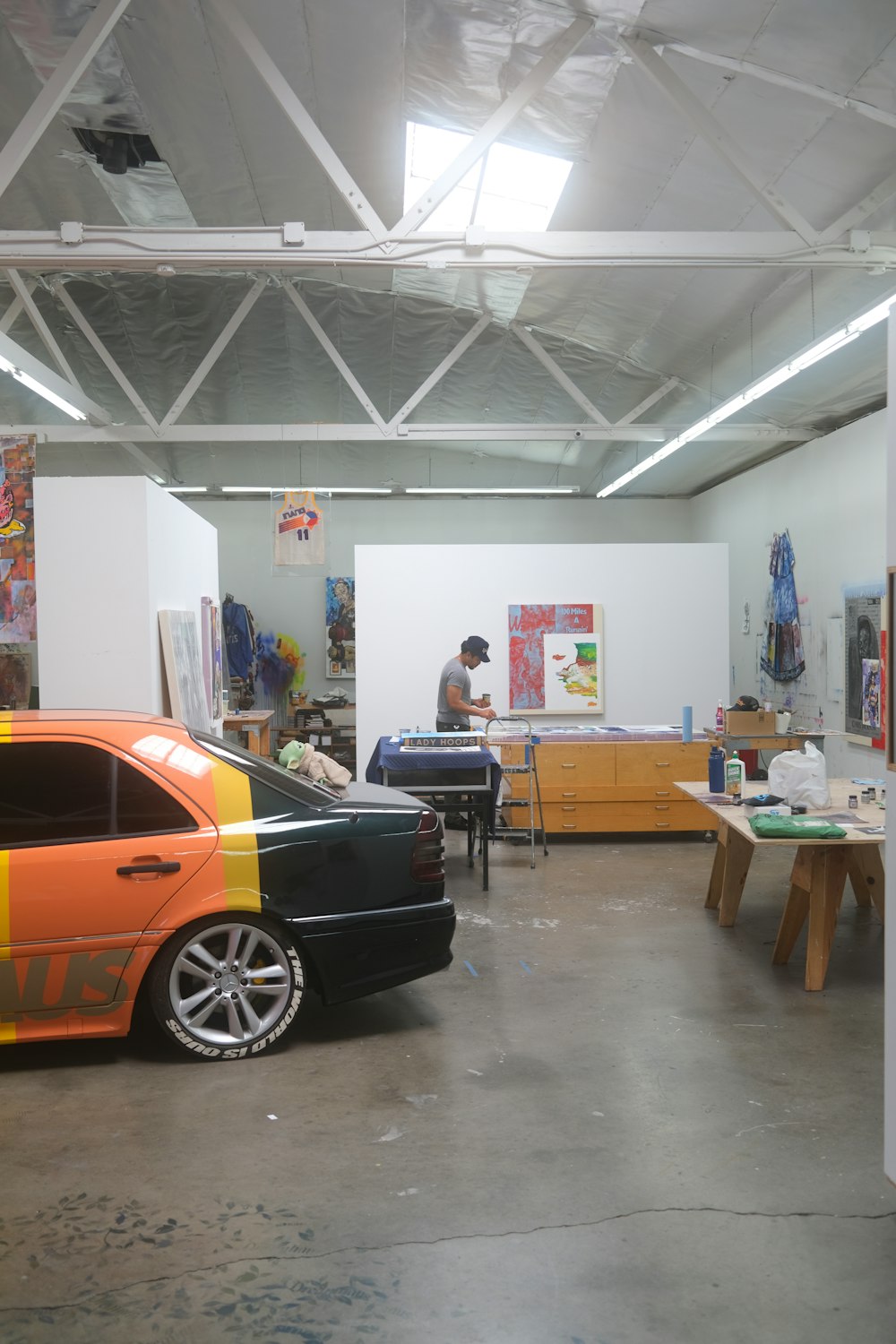 a car parked in a garage next to a table