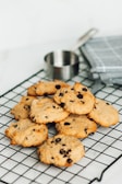 A tray of freshly baked cookies cooling on a rack.