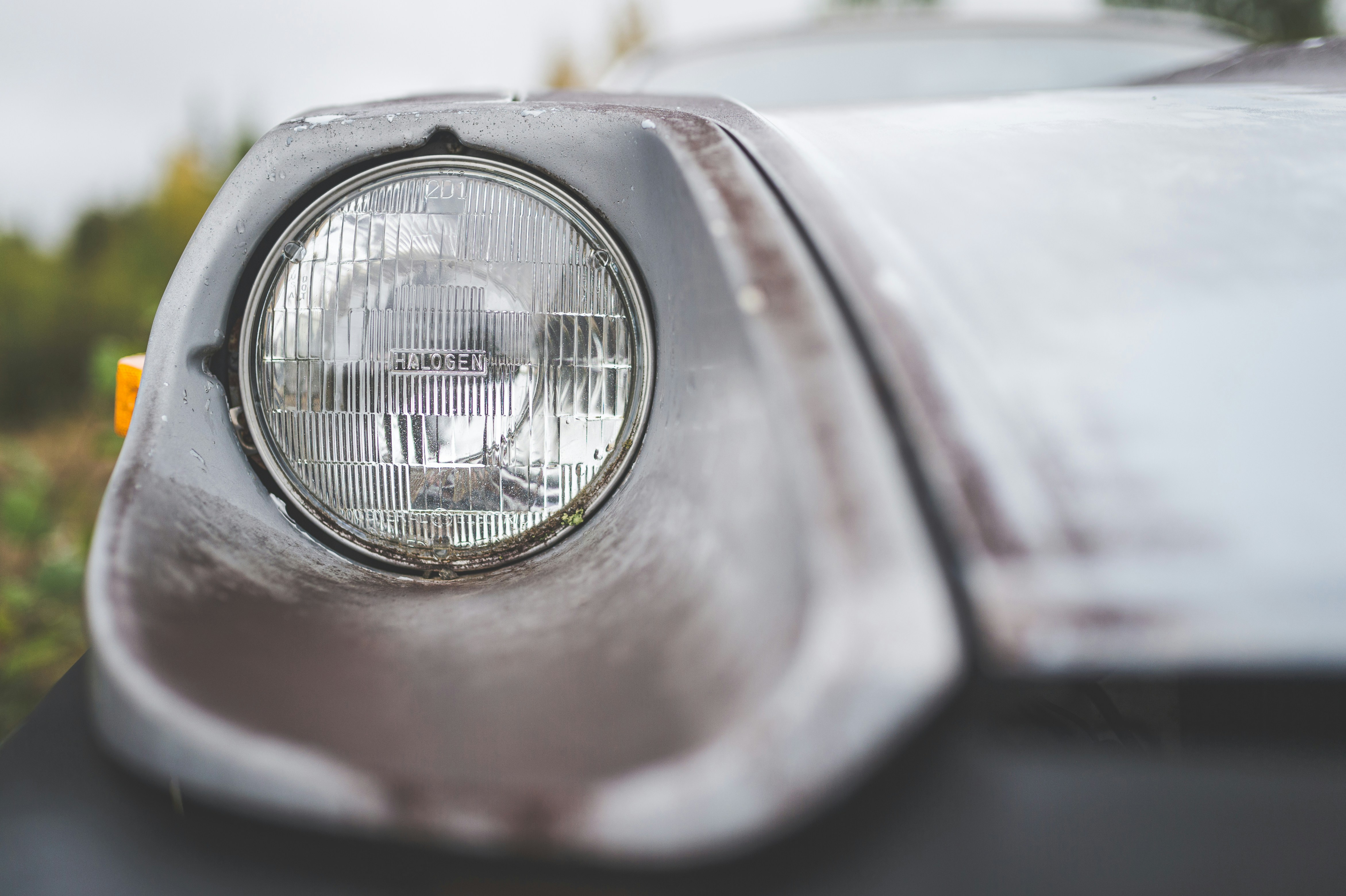 a close up of a headlight on a car