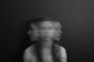 A blurred photograph capturing motion and stillness in a single frame, hinting at impermanence.