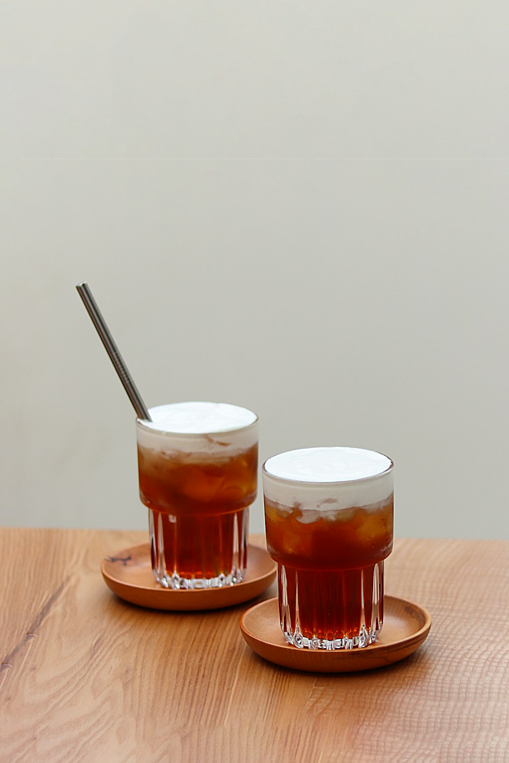 a couple of cups sitting on top of a wooden table