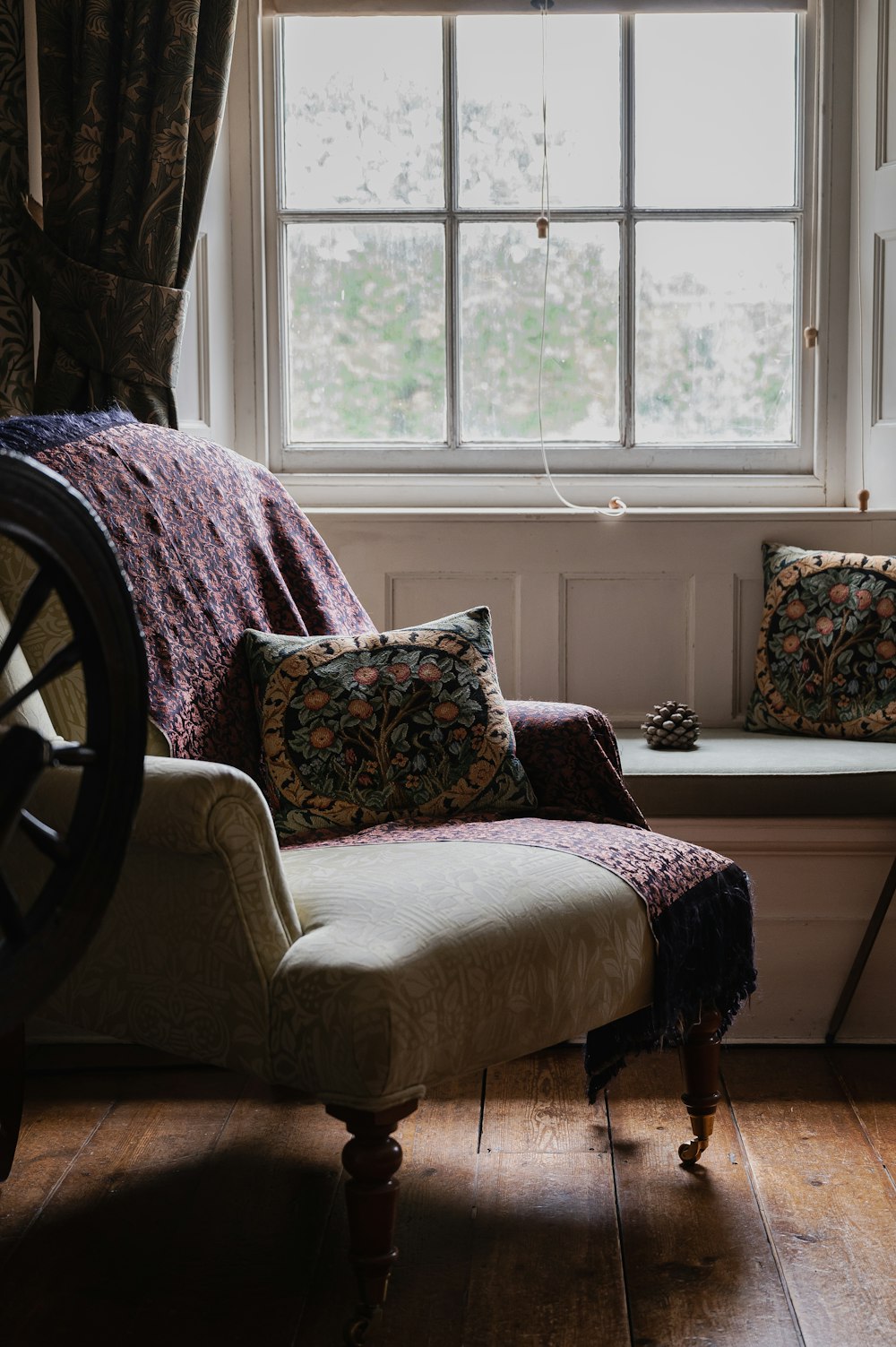 a living room with a chair and a window