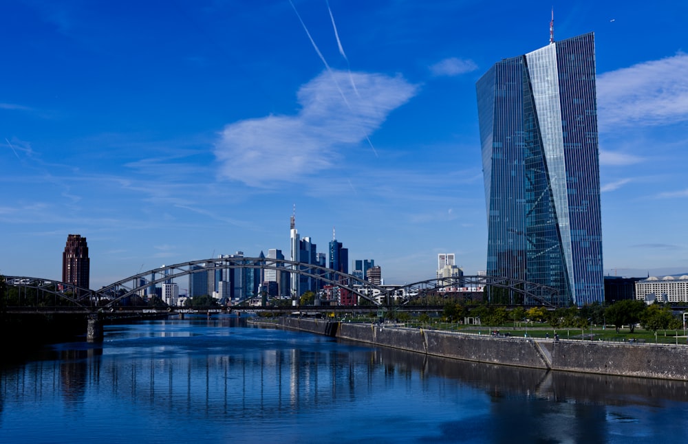 a river running through a city next to tall buildings