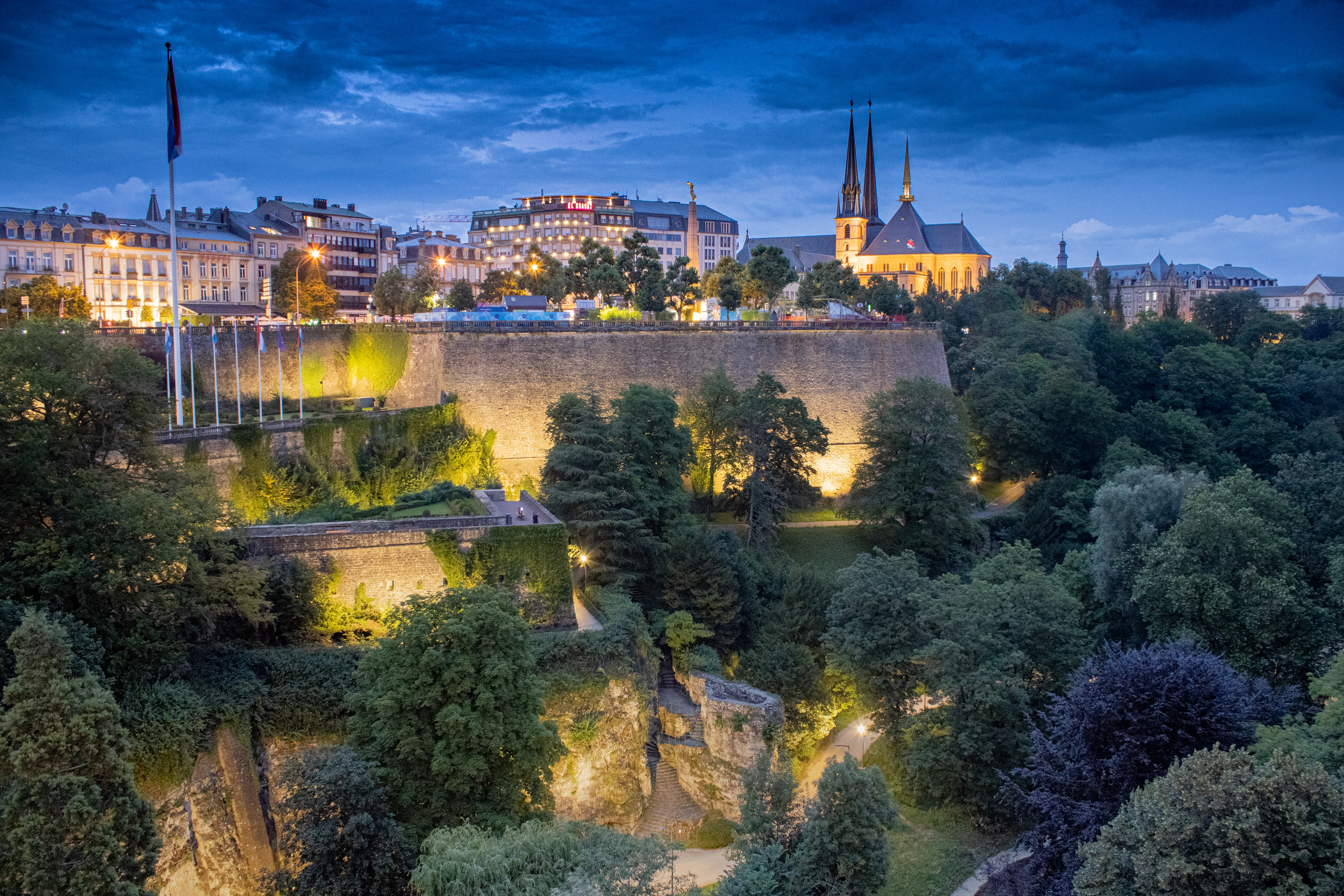 Luxembourg City's Grund at dusk, the floodlit fortifications above the Alzette