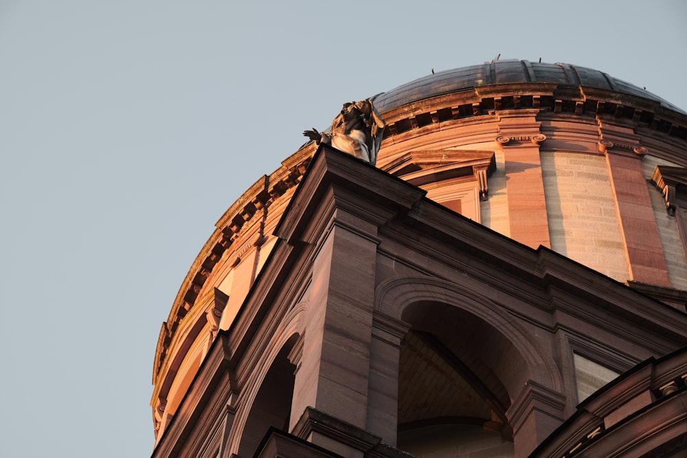 a tall building with a clock on the top of it