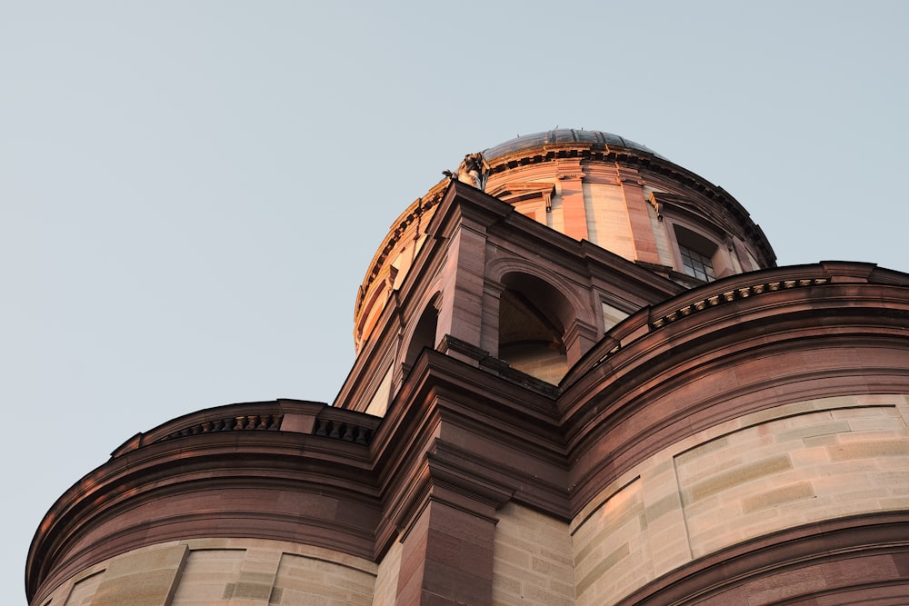 a tall building with a clock on the top of it