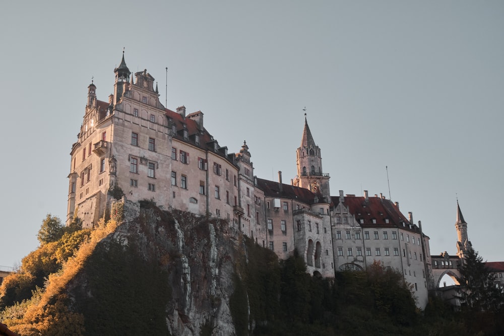 a castle on top of a hill with a steeple