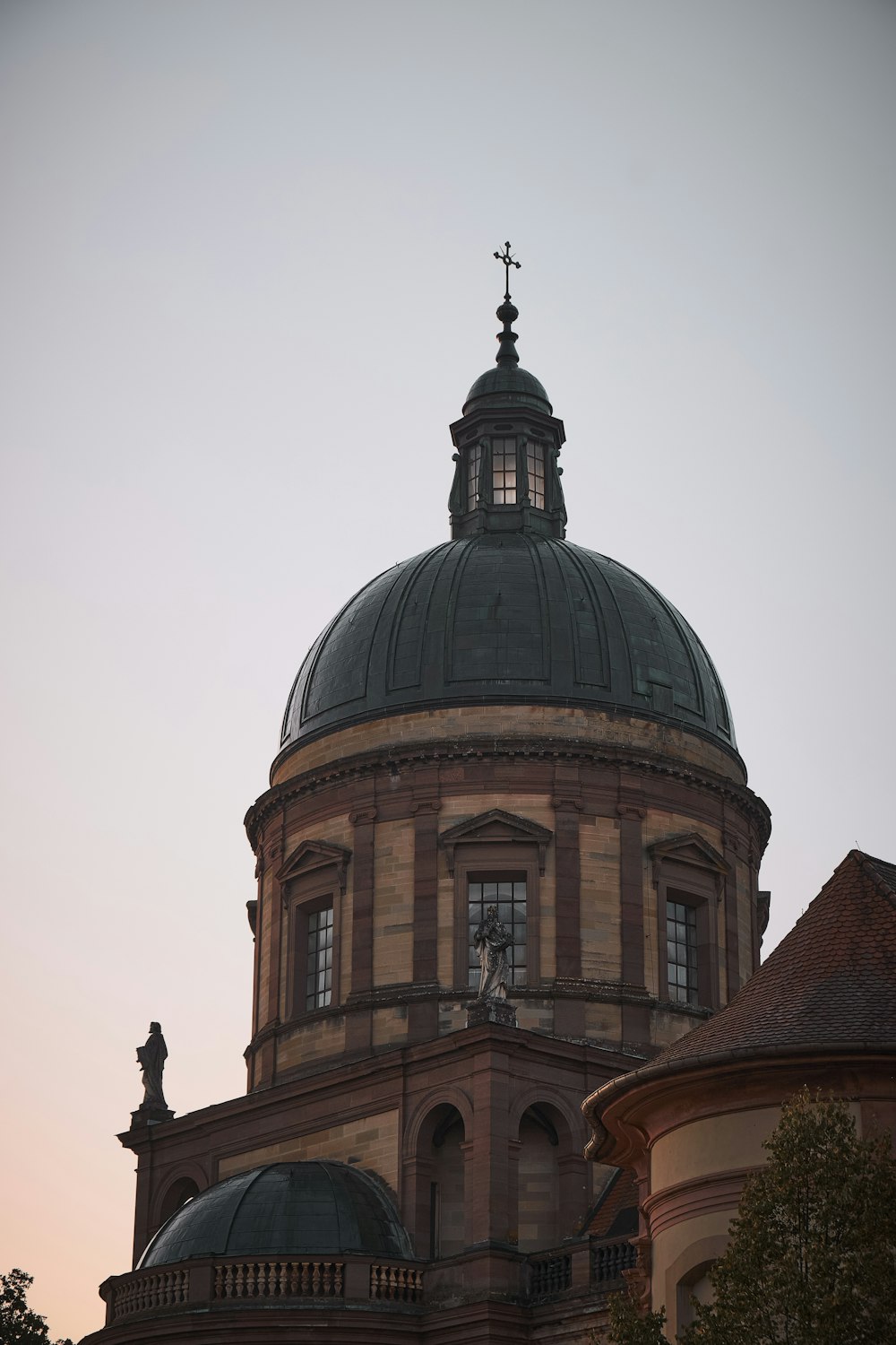 a large building with a cross on top of it