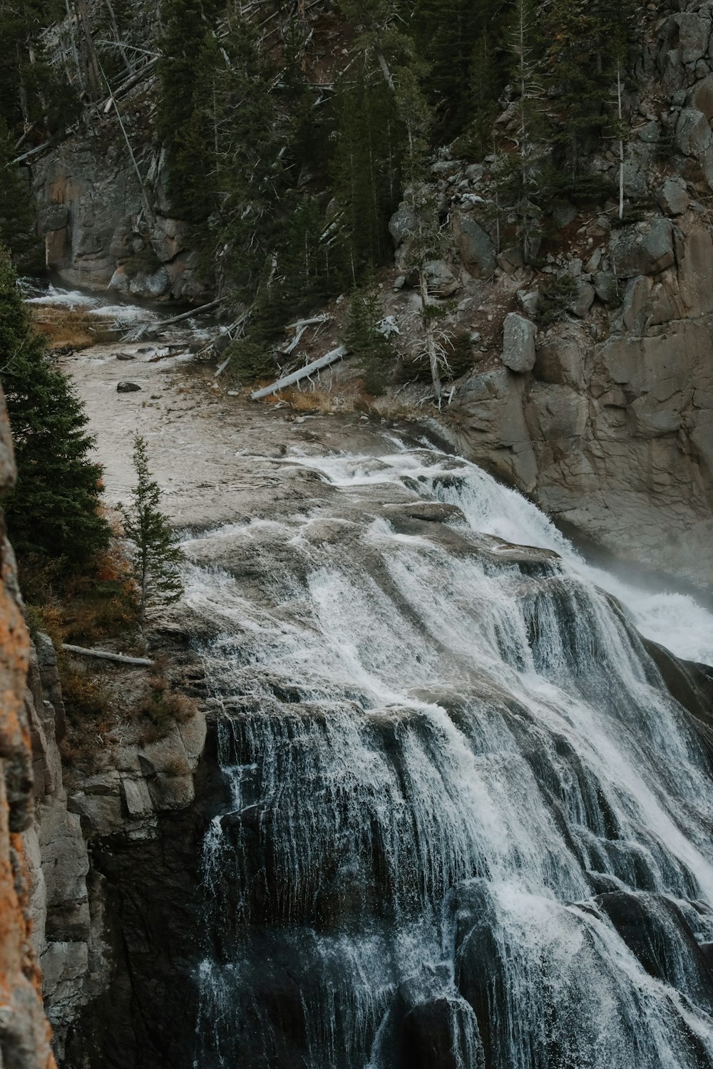 a large waterfall with water coming out of it