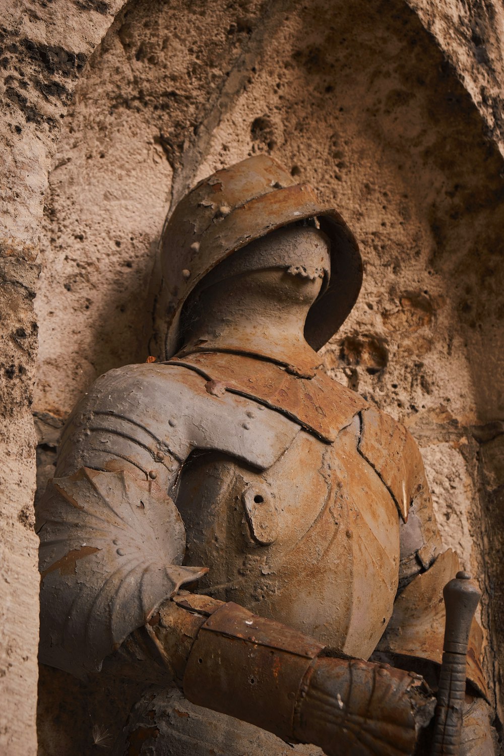 a close up of a statue of a knight