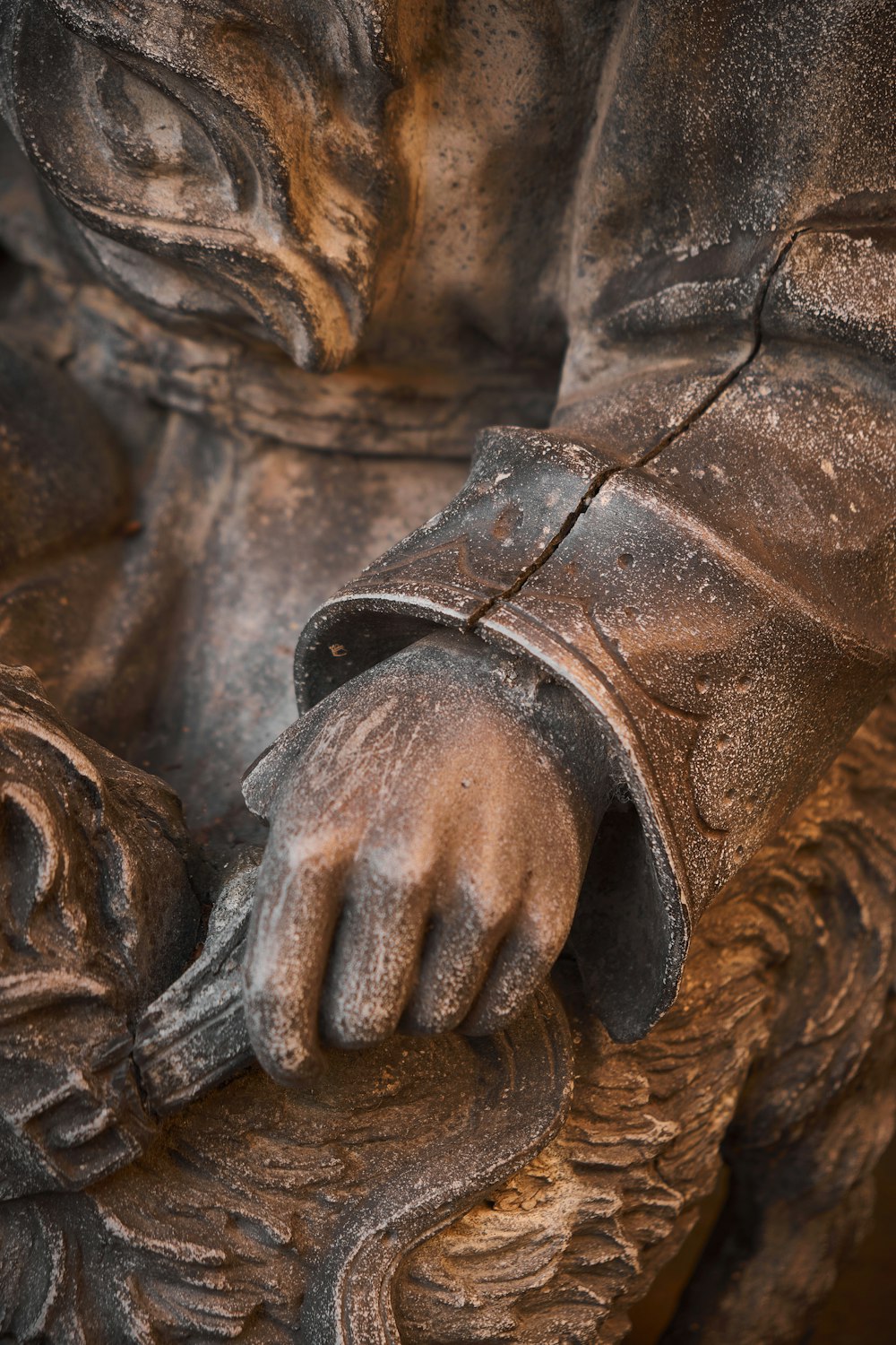 a close up of a statue of a person holding something