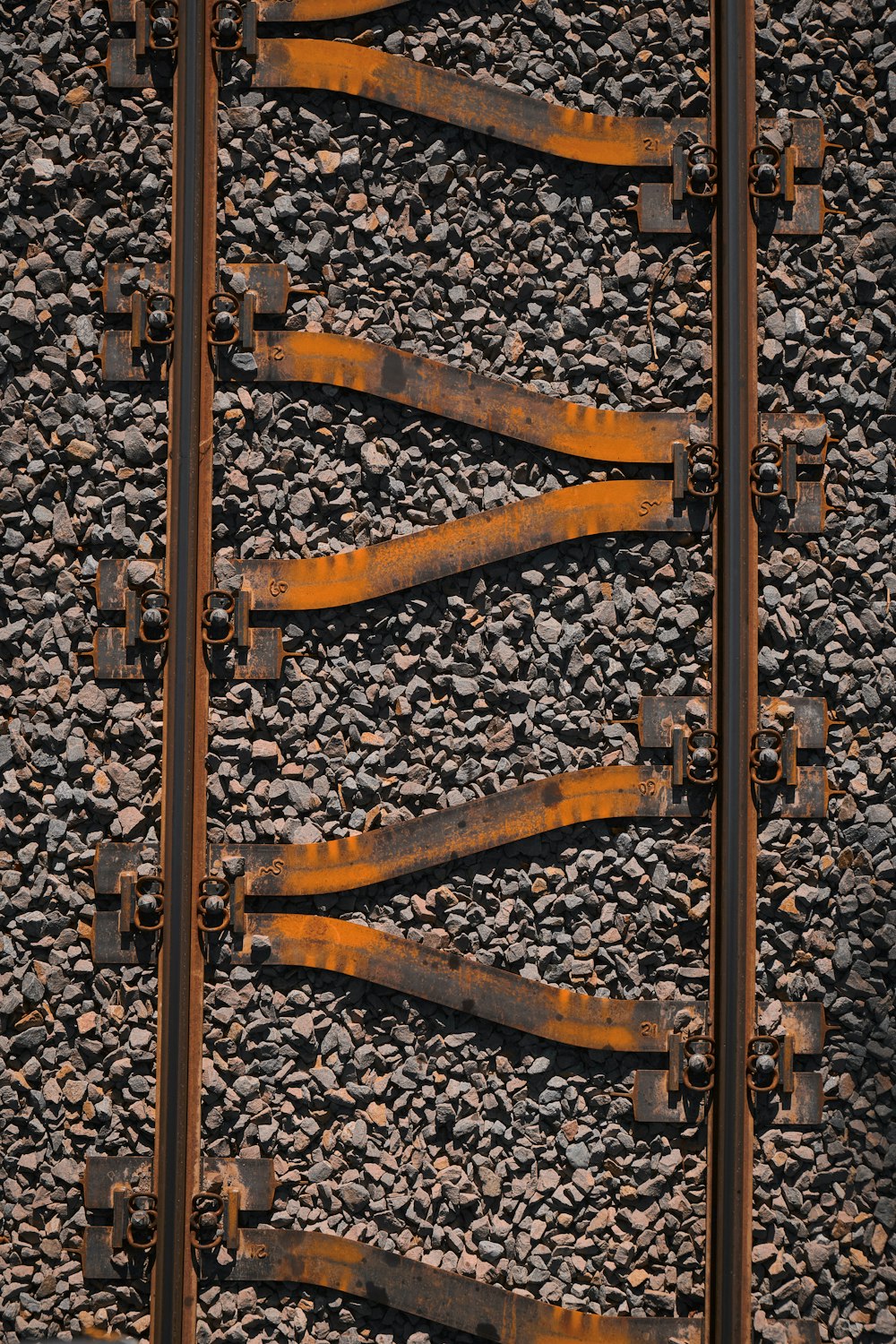 a close up of a train track with rust on it