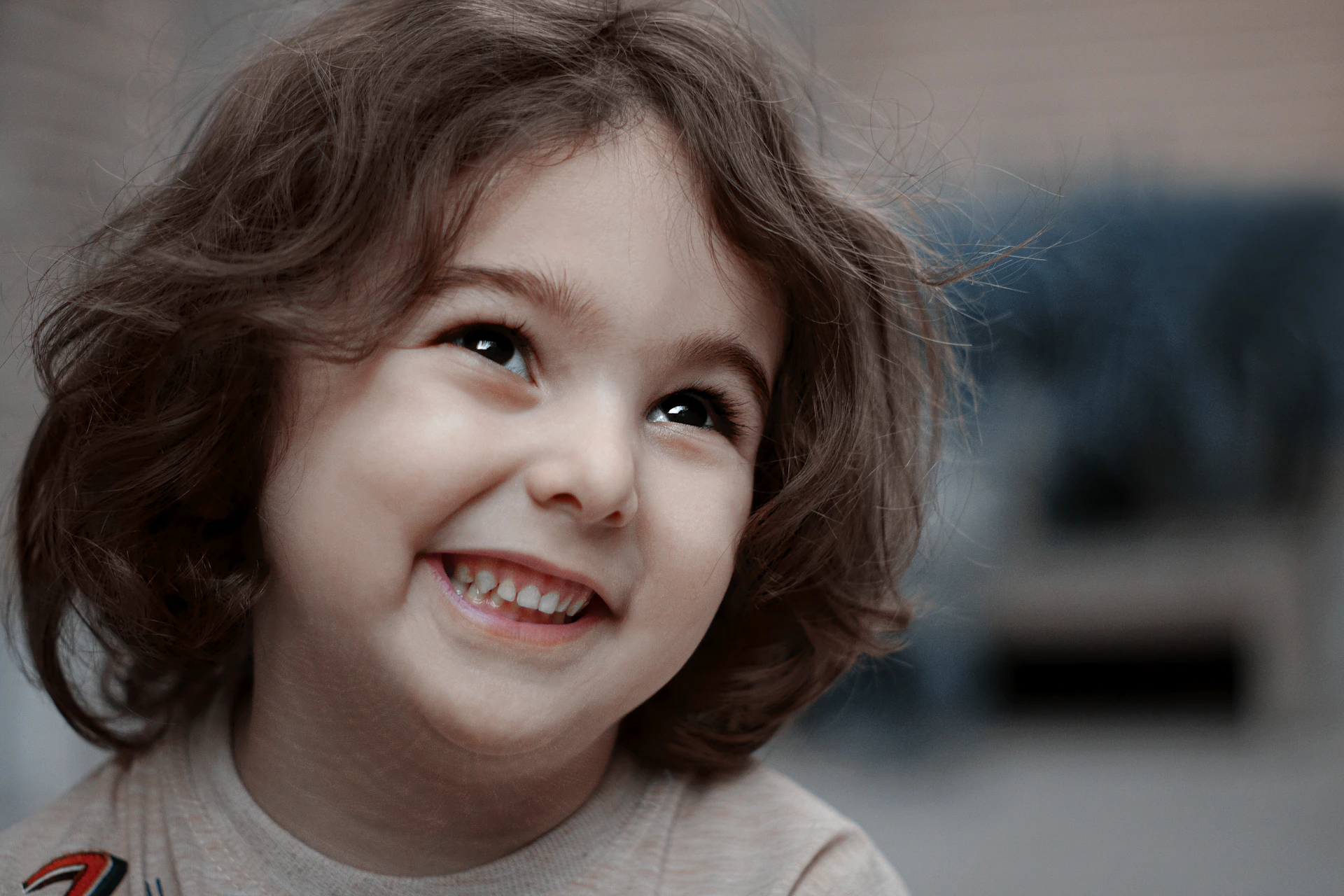 a little girl with a smile on her face