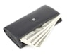a wallet with money sticking out of it