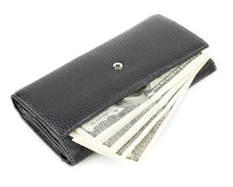 a wallet with money sticking out of it