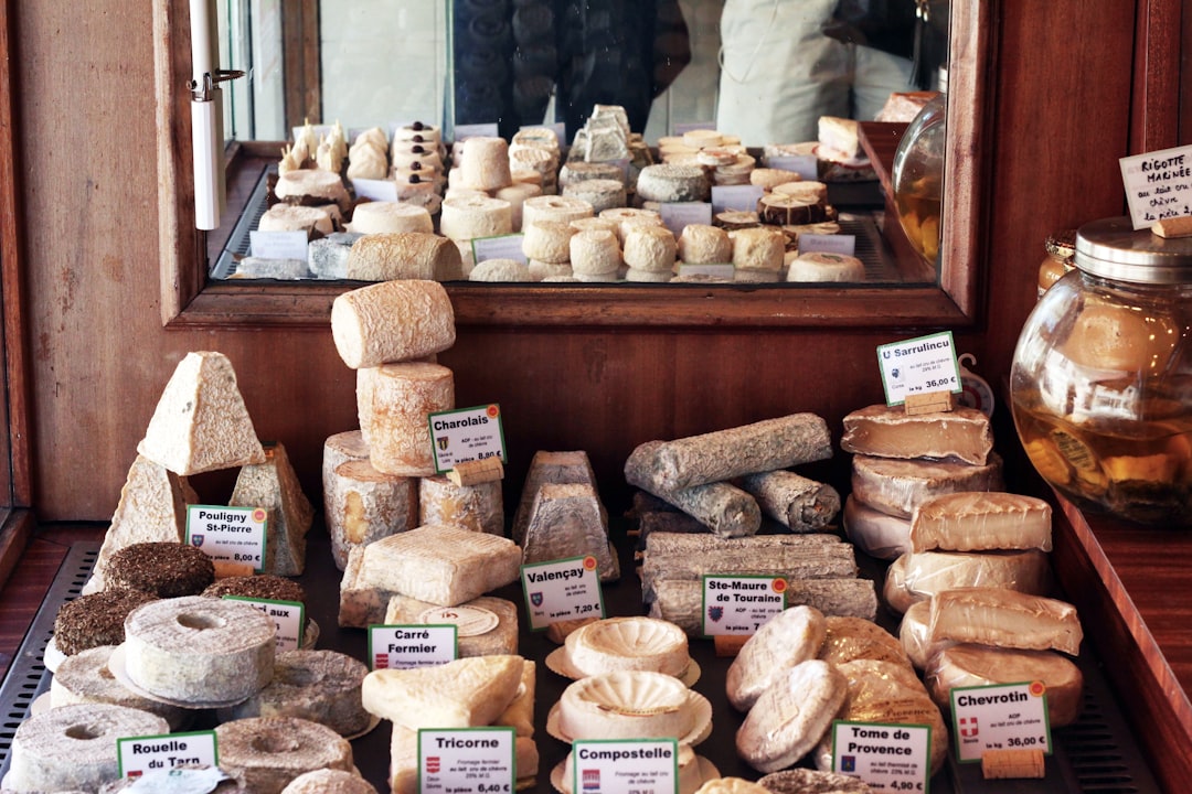 a bunch of different types of bread on a table, too many to count