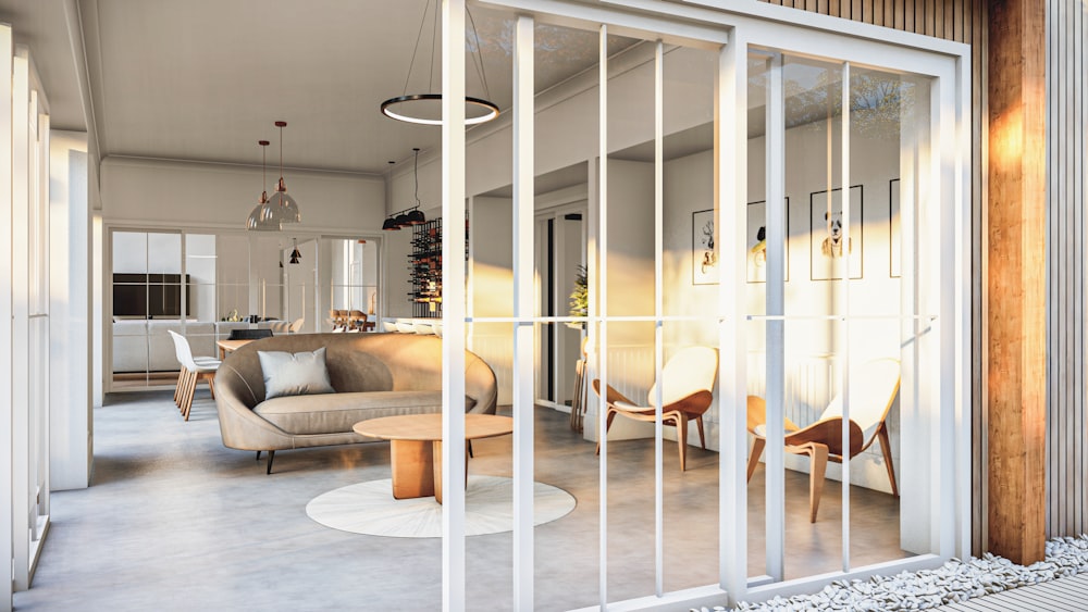 a living room filled with furniture and a sliding glass door