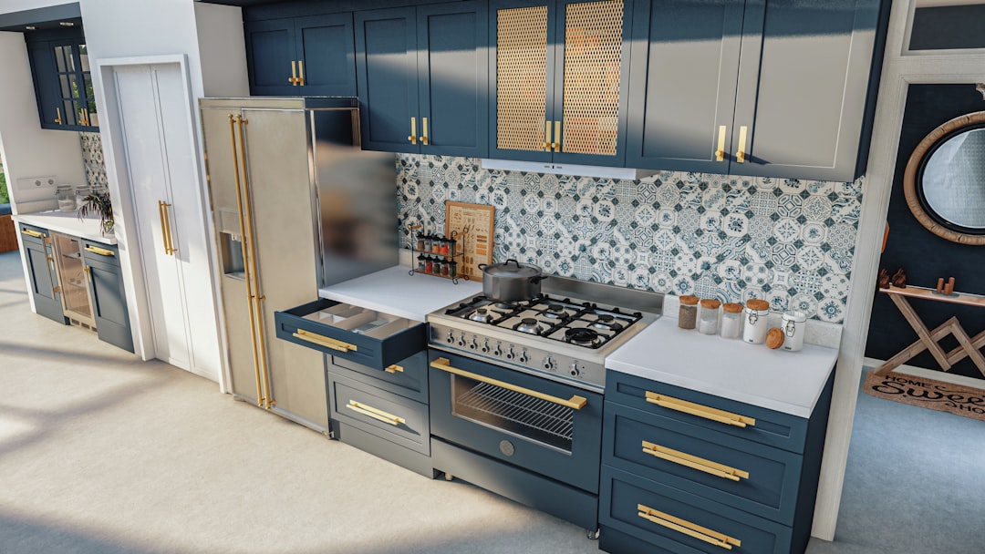 a kitchen with blue cabinets and gold trim,