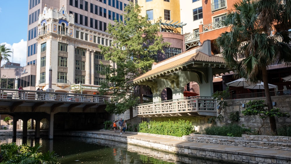 a river running through a city next to tall buildings