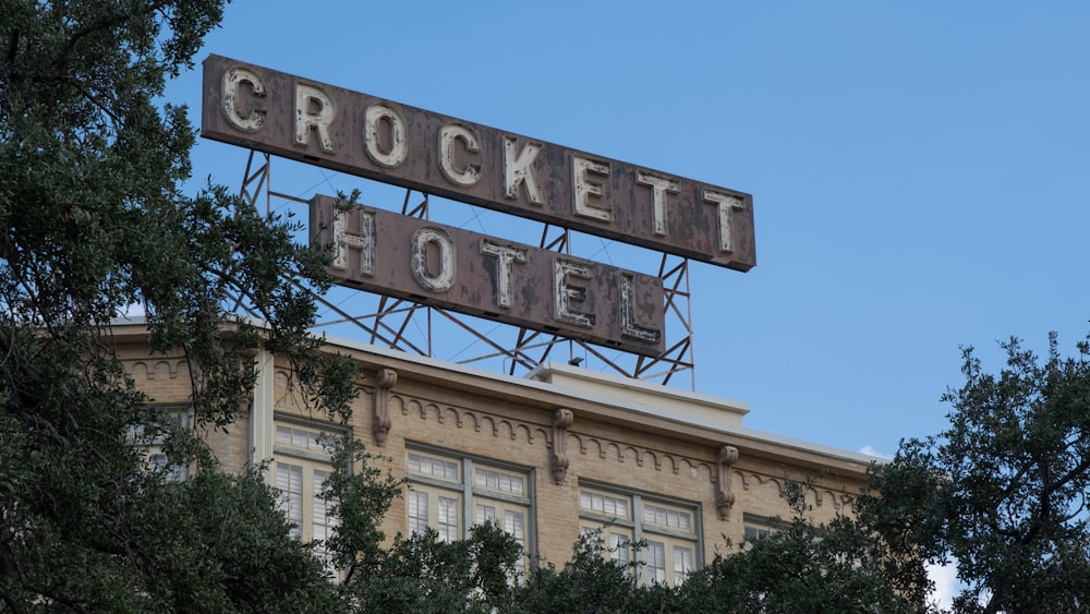 a sign that reads crockett hotel on top of a building
