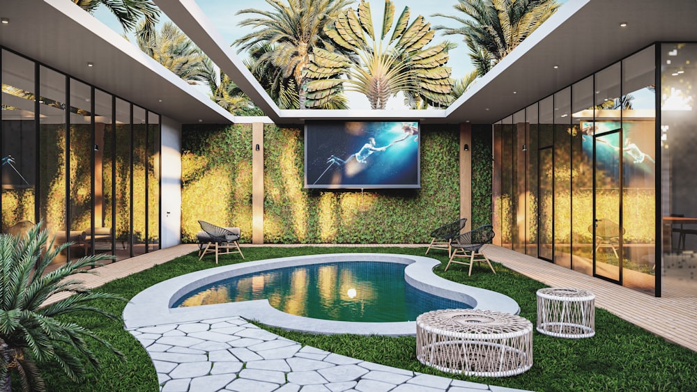 un patio trasero con piscina y televisión