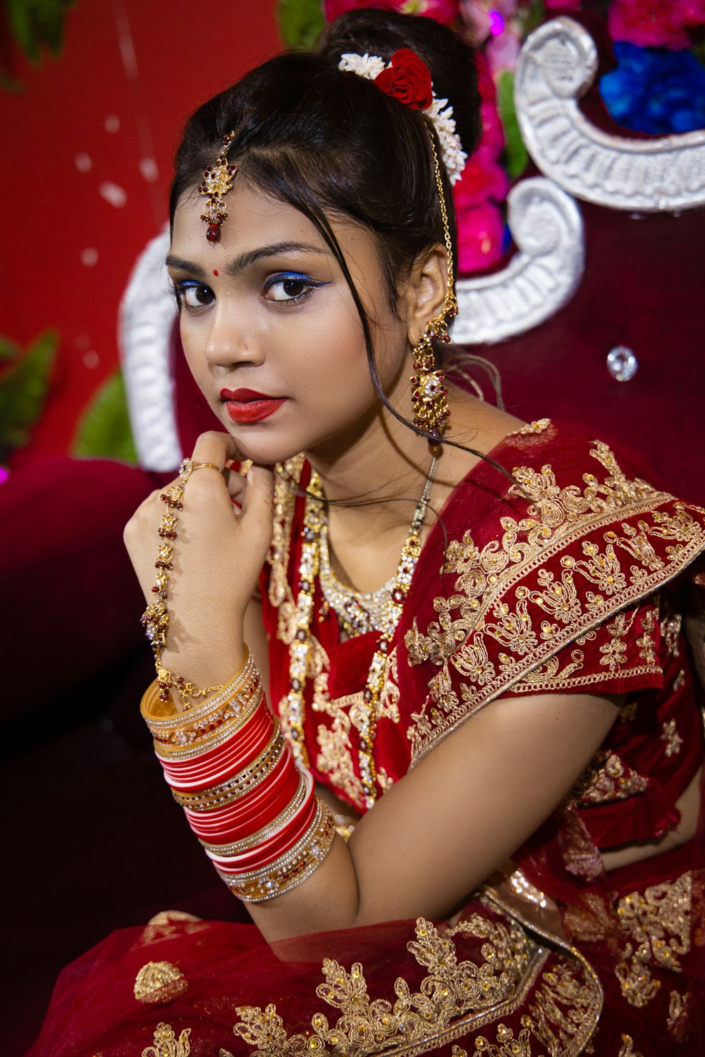 a woman in a red and gold outfit