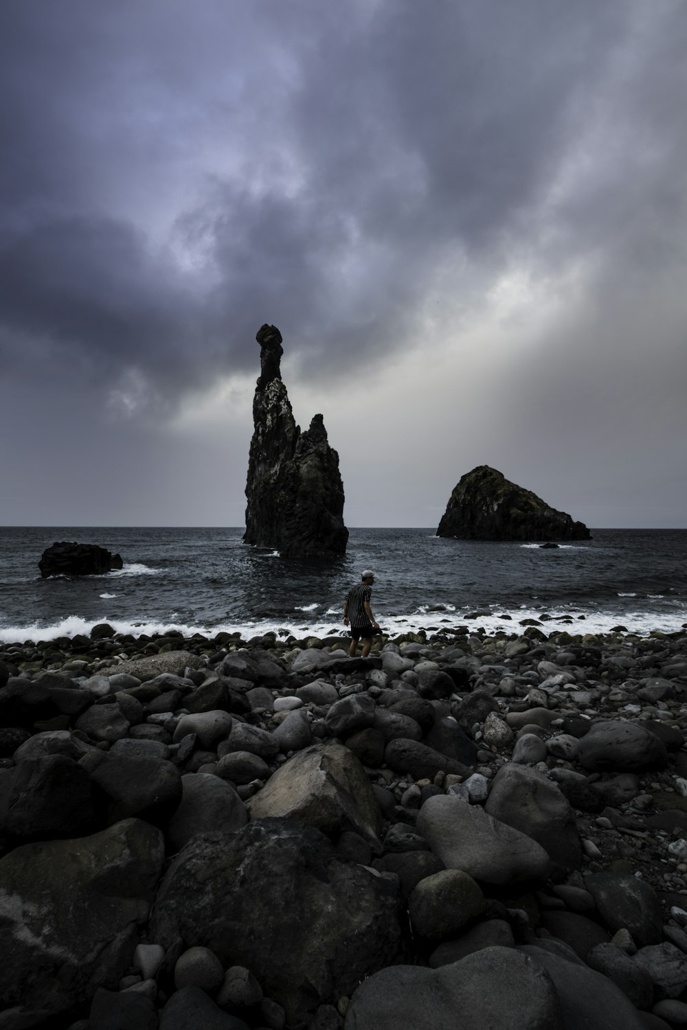 a black and white photo of a rocky beach