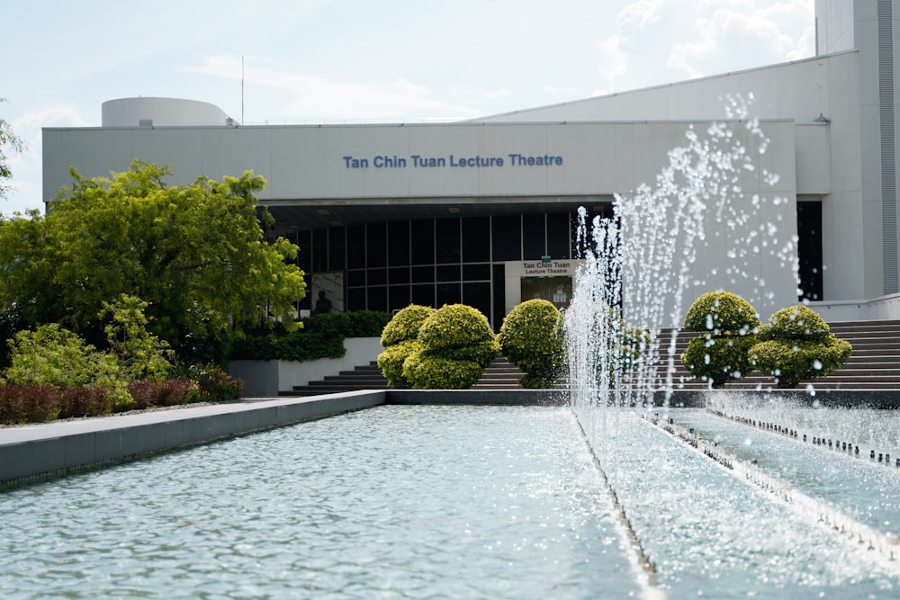 a water fountain in front of a building