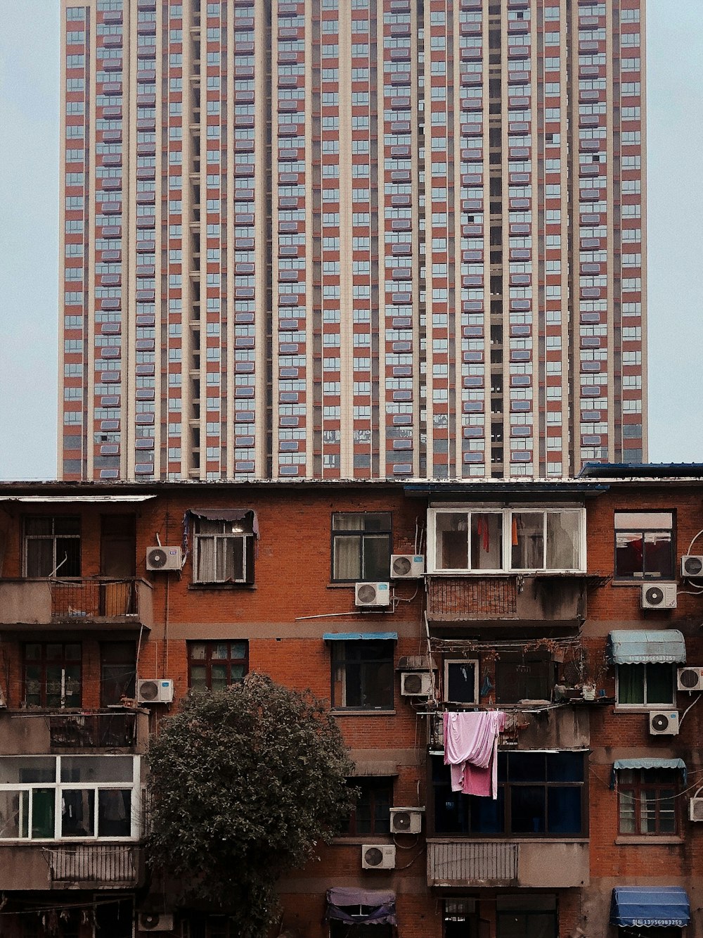 a tall building with lots of windows and balconies