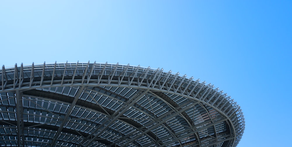 a large metal structure with a sky background