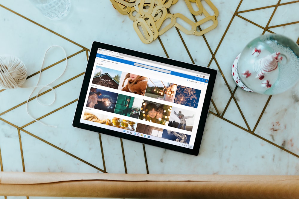 Surface Laptop on table with Christmas decorations surrounding 