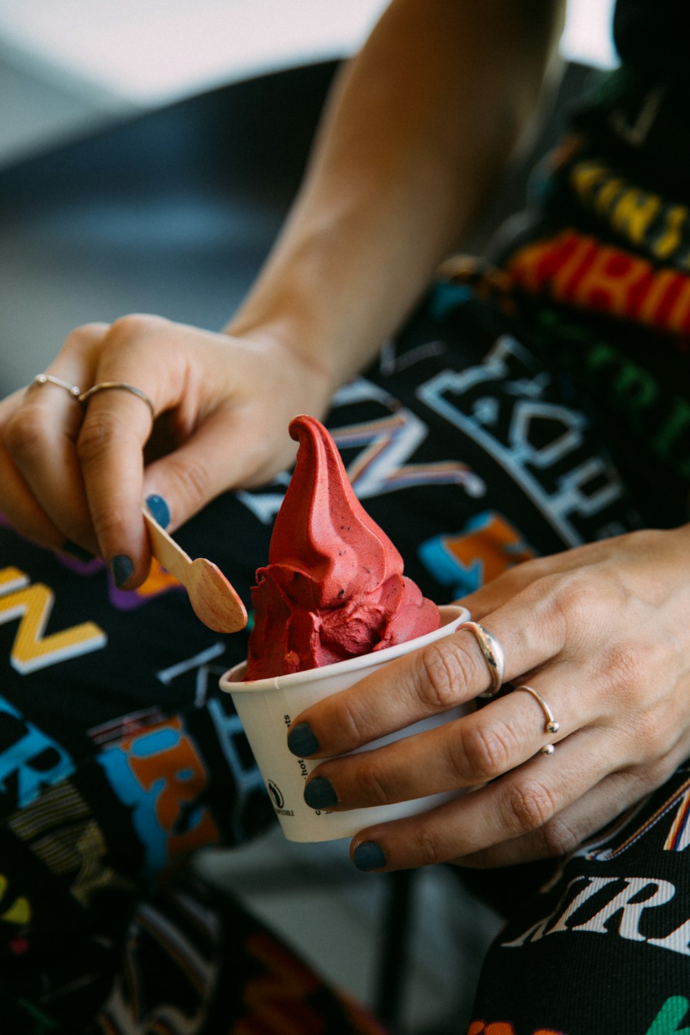 a woman is holding a bowl of ice cream