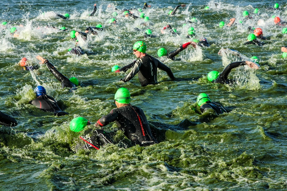 a group of people swimming in the ocean